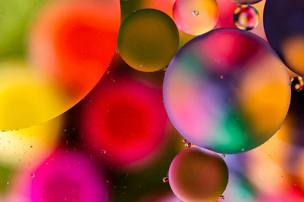 Colorful surface with abstract round shapes structure of oil in water — Stock Photo, Image