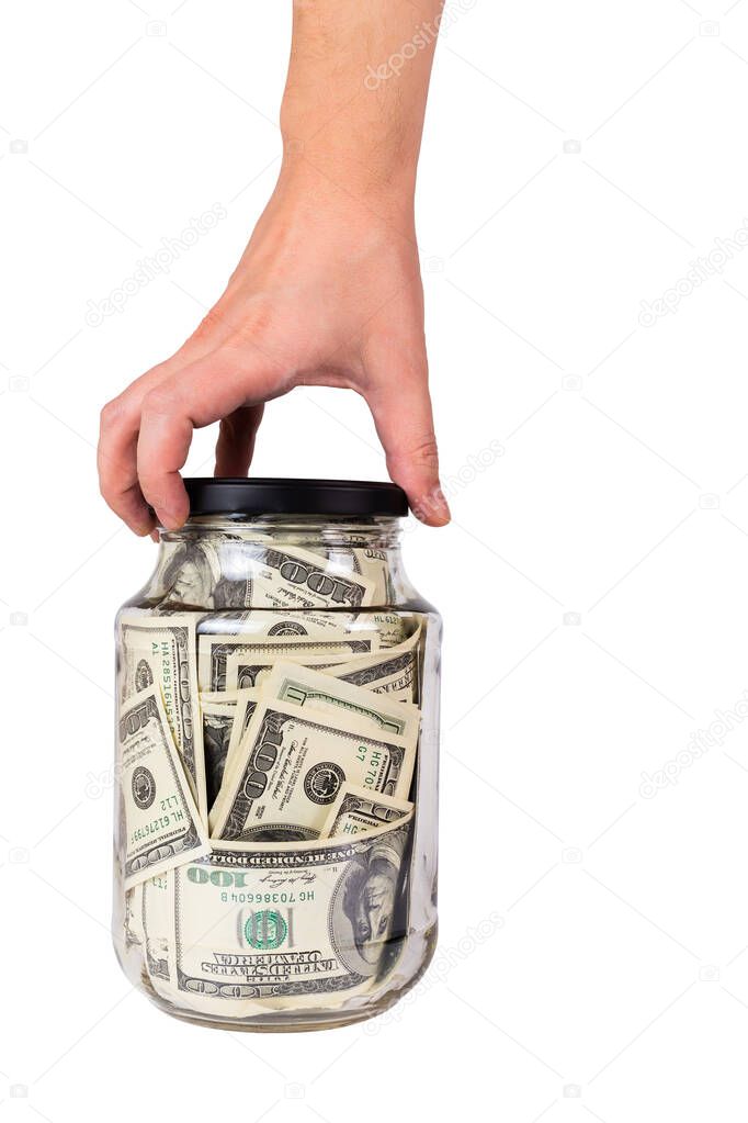 hand holding glass jar full of us dollar banknotes isolated on white background