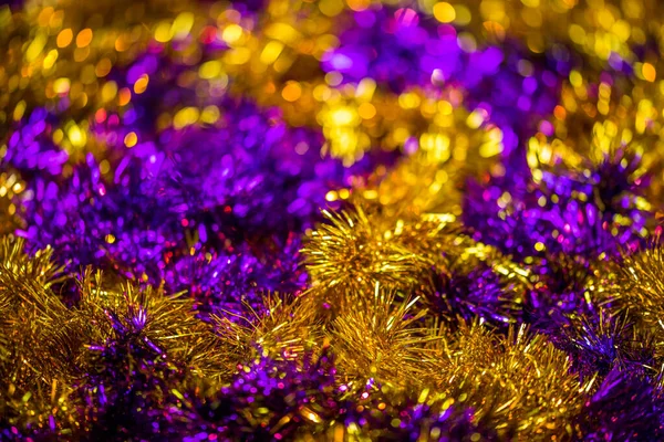 Abstract pink and gold tinsel close-up background with bokeh defocus — Stock Photo, Image