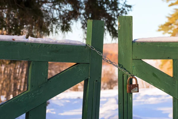 closed wooden gate at winter daylight