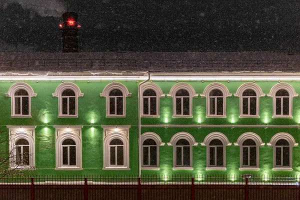 Green house under winter dark night snowfall — Stock Photo, Image