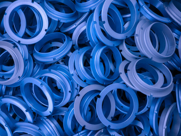 an abstract background of blue phantom blue color coated metal ring parts