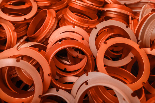 an abstract background of lush lava color coated metal ring parts