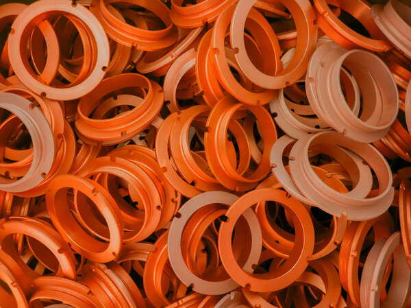 an abstract background of lush lava color coated metal ring parts