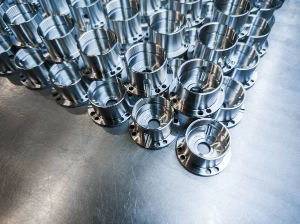 Shiny metal aerospace parts after cnc machining on steel surface with selective focus, industrial background — Stock Photo, Image