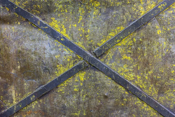 obsolete painted industrial flat iron panel texture with welded steel diagonal cross stripes for rigidity