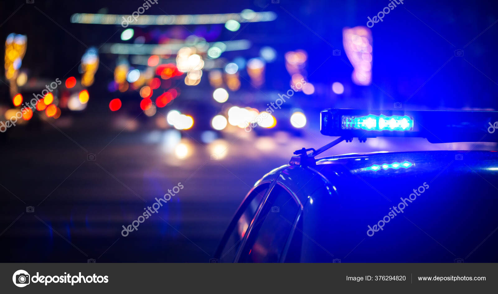 Night police car lights in city closeup with selective focus and