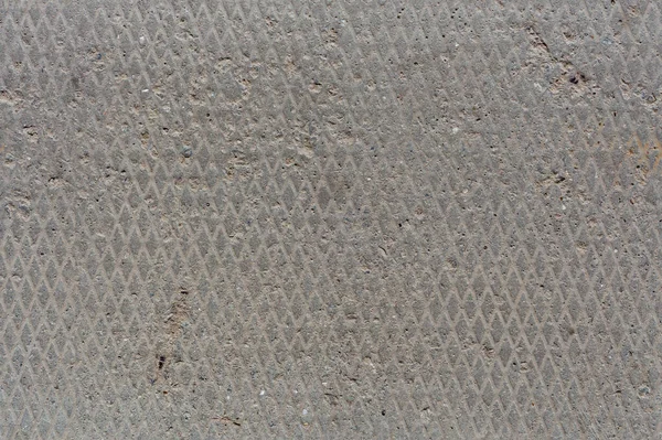 Płynna konsystencja betonu z diamentowym wzorem i oznakami lekkiej erozji, stare płaskie i suche — Zdjęcie stockowe