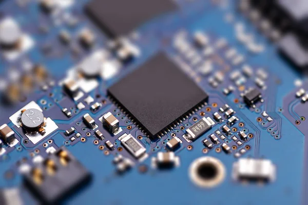 Microprochip on blue circuit board — Stock Photo, Image