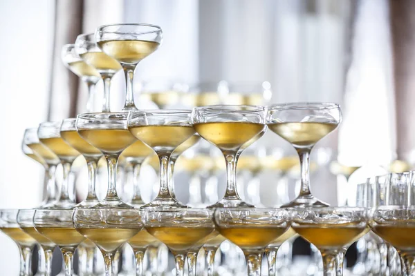 Champagne glasses standing in a tower — Stock Photo, Image