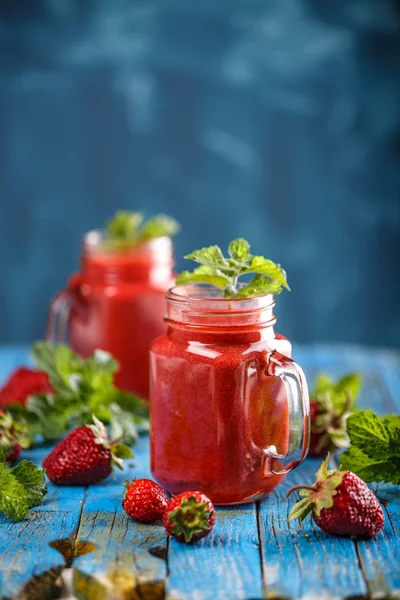 Strawberry smoothie in jars — Stock Photo, Image