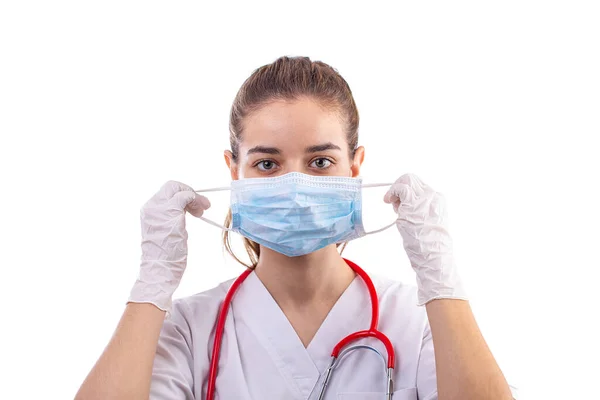 Woman puts on a protective mask — Stock Photo, Image