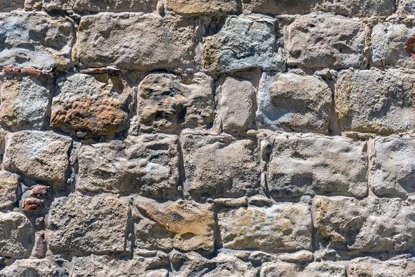 Rough brown natural stone wall — Stock Photo, Image