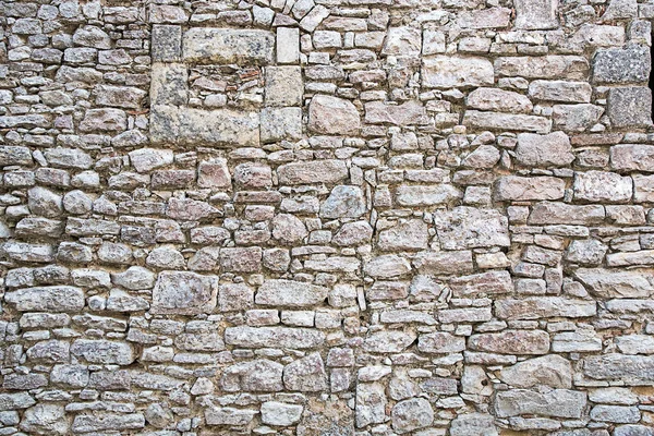 Rough wall of natural stone — Stock Photo, Image