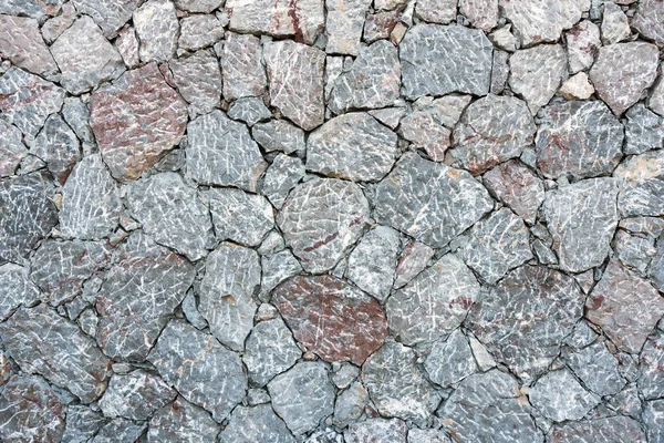 Ruwe grijze natuurlijke stenen muur — Stockfoto