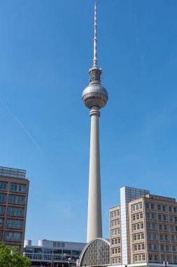 The Fernsehturm, Berlins most famous landmark, on a sunny day clipart