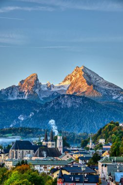 Mount Watzmann and the city of Berchtesgaden early in the morning clipart