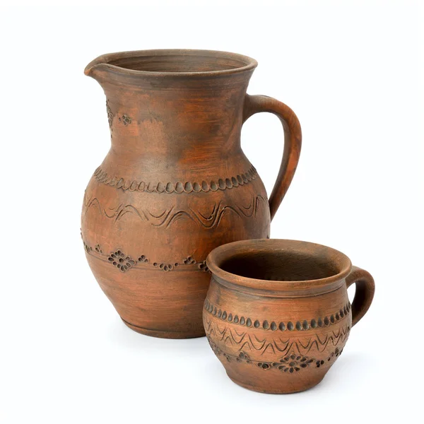 Clay jug and cup isolated on white — Stock Photo, Image