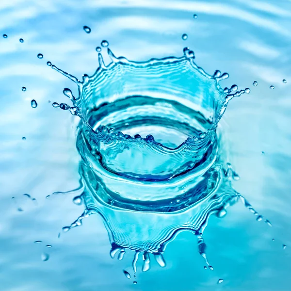 Splash water on blue background — Stock Photo, Image