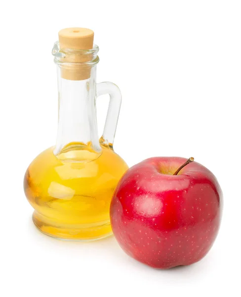 Бутылка яблочного уксуса и яблоко — стоковое фото