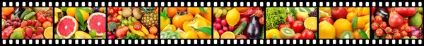 Breed frame in de vorm van filmstrook met groenten en fruit. — Stockfoto