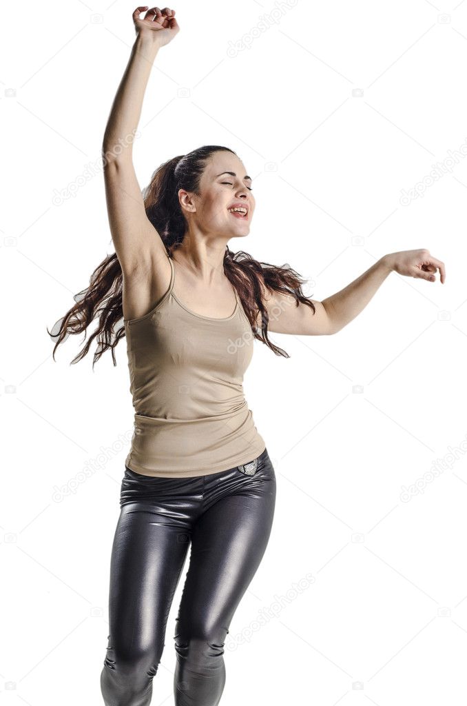 Young woman in tank top and leather trousers dancing fashionable modern dance