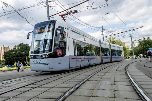 MOSCOW,RUSSIA - AUGUST 02  2017-Tram in Moscow on a background of modern residential high-rise building — Stock Photo, Image