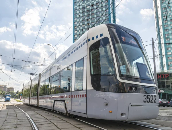 MOSCOW,RUSSIA - AUGUST 02  2017-Tram in Moscow on a background of modern residential high-rise building — Stock Photo, Image