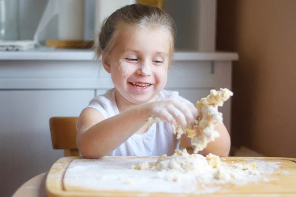 Adorable little girl making the dough for pasta — Stock Photo, Image