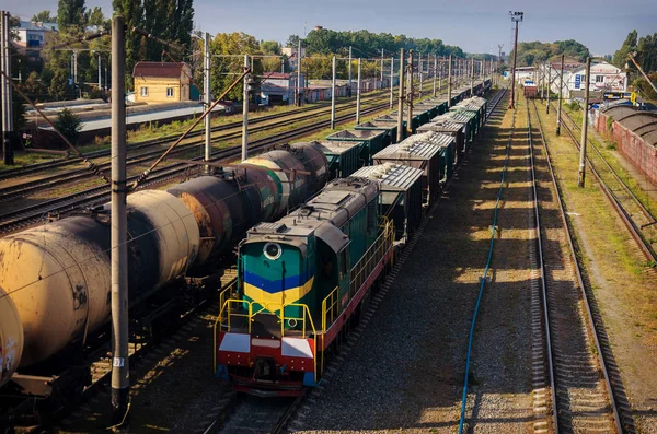 View of the old dusty railway with freight cars and power lines — Stock Photo, Image