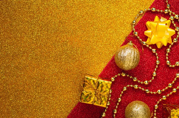 Gold and red sparkles background with gold (yellow) decorations — Stock Photo, Image