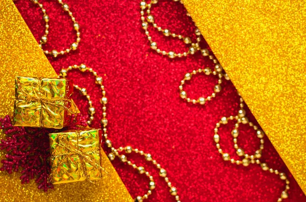 Combination of red and gold with a gift box, beautiful beads, a — Stock Photo, Image