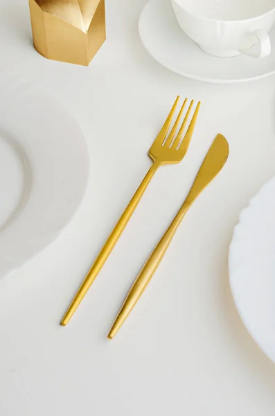 Modern trendy matte gold appliances - fork and knife — Stock Photo, Image