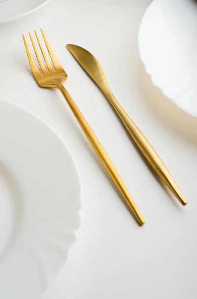 Modern trendy matte gold appliances - fork and knife — Stock Photo, Image