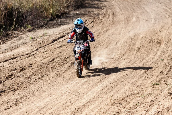 Boy during motorcycle cross-country competition — Stock Photo, Image
