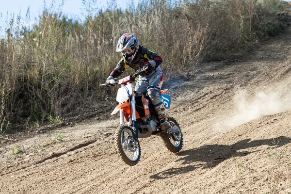Boy during motorcycle cross-country competition — ストック写真