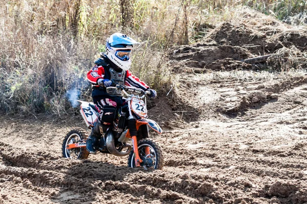 Boy during motorcycle cross-country competition — ストック写真