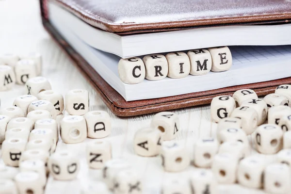 Word CRIME on old wooden table. — Stock Photo, Image