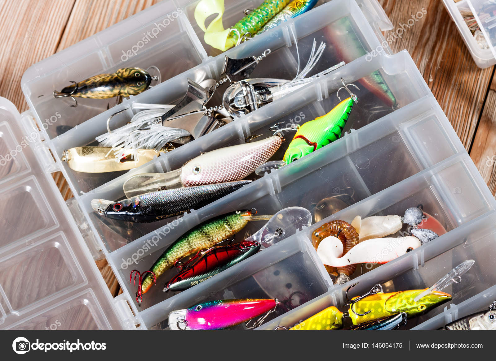 Fishing accessories on a wooden background. Stock Photo by ©Alex_Ishchenko  146064175