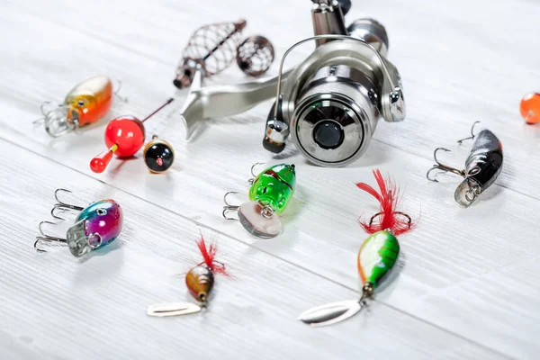 Fishing accessories on a wooden background. — Stock Photo, Image