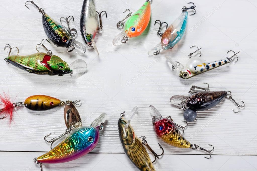 Fishing accessories on a wooden background.