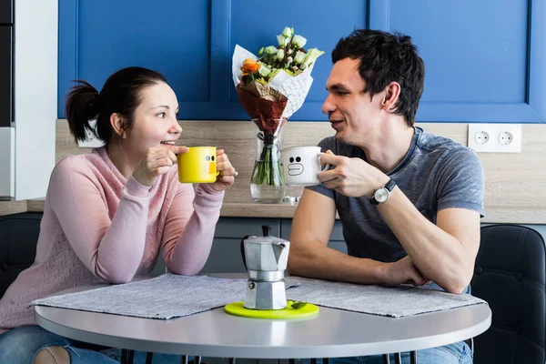Cheerful beautiful young couple at home Stock Image
