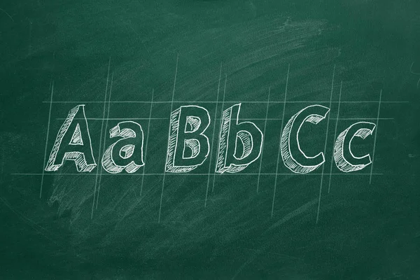 ABC - the first letters of the English alphabet on greenboard — стоковое фото