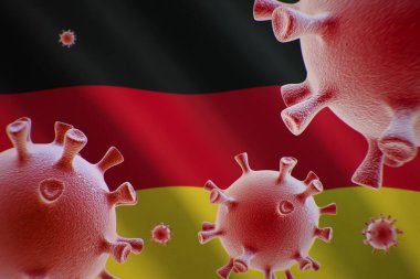 COVID-19. Almanya bayrağının arka planında Coronavirus hücreleri