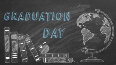 Mezuniyet Günü, dönen dünya ve okul kitapları tahtaya tebeşirle çiziliyor.. 