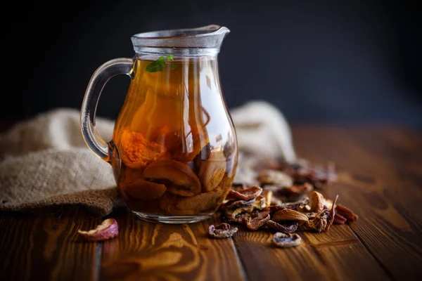 Compote of dried fruits in a carafe — Stock Photo, Image