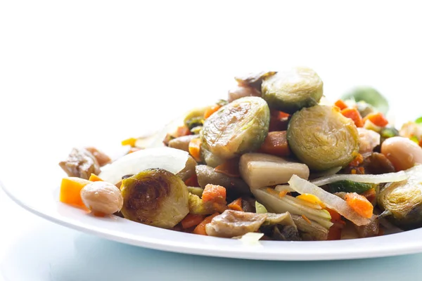 Brussels sprouts roasted with vegetables and beans — Stock Photo, Image