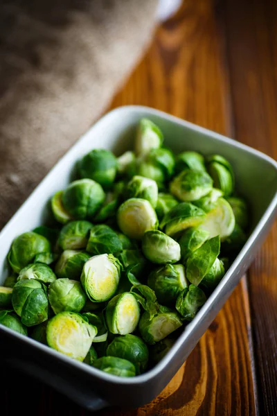 Raw Brussels sprouts in ceramic form — Stock Photo, Image