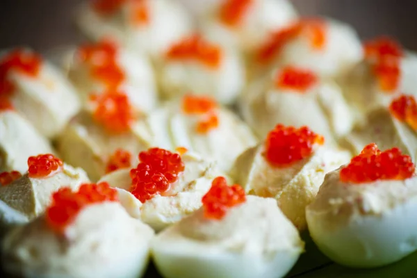 Eggs stuffed red caviar — Stock Photo, Image