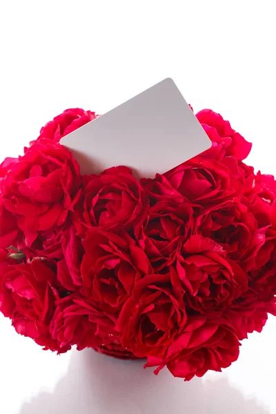 Bouquet of red roses in a wicker vase — Stock Photo, Image